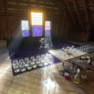 Thema-Mundi-Jupiter-Candles-Hand-Window-Reflections-Illuminating-Prayers